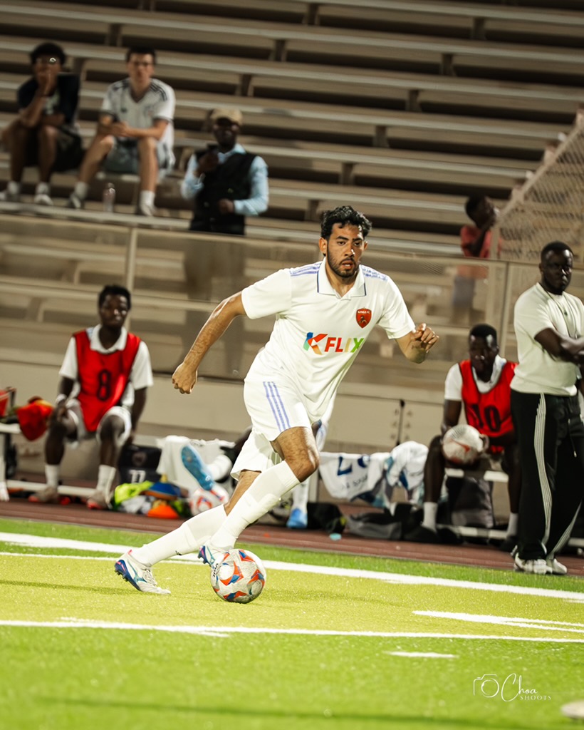 Kings FC match action under the lights.